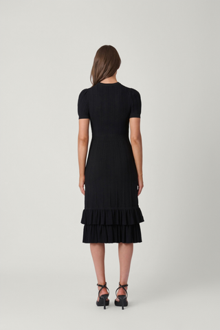 Shoshanna Savannah Dress in Jet featuring a black pointelle knit, short puff sleeves, fit-and-flare silhouette, and tiered ruffle midi hem.
