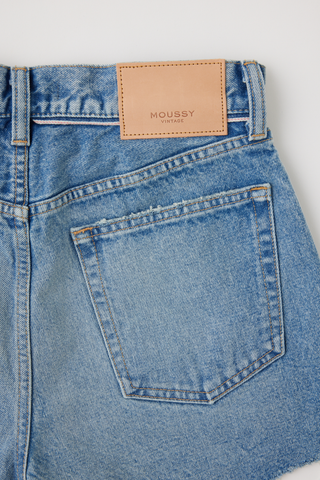 Light wash Moussy denim shorts with mid rise fit and frayed hem detail