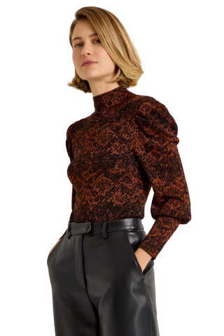 Roxi Top in Oxide featuring a rust and black abstract print, fitted turtleneck silhouette, and pleated puff sleeves.
