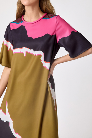 Crosby Grayson Dress in Portoro featuring an olive, pink, black, and cream abstract print in a relaxed maxi silhouette.