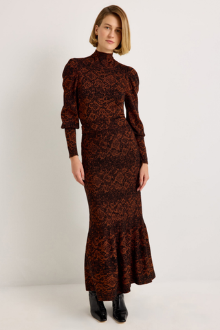 Shiloh Skirt in Oxide featuring a rust and black abstract print, fitted silhouette, and softly flared mermaid hem.