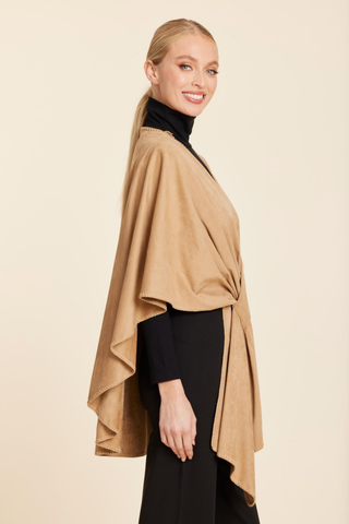 Dolce Cabo Faux Suede Wrap in Camel featuring a soft suede-like finish, draped cape silhouette, and elegant twist-front detail.