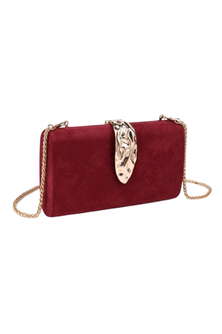 Urban Expressions Babe Clutch in Burgundy featuring a rich suede-effect exterior, sculptural hammered metal clasp, and removable chain strap.