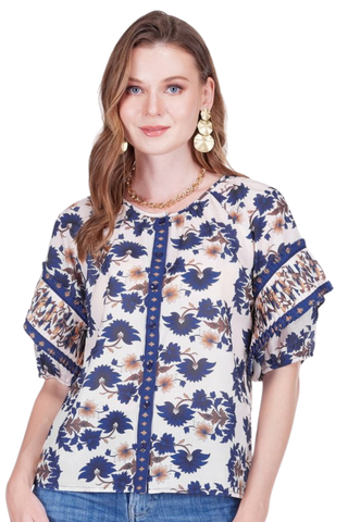 Woman wearing a floral blouse with a white background