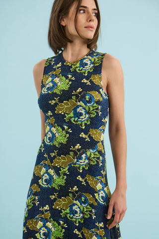 Hunter Bell Barker Dress in Primrose featuring a colorful floral print, sleeveless bodice, and flowing maxi-length silhouette.