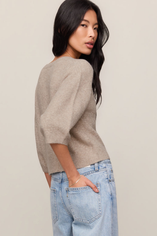Natural heather button-front cardigan with elbow-length sleeves.