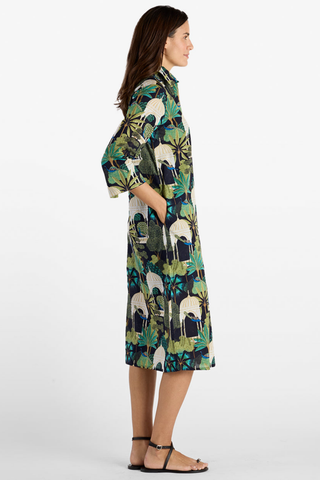 Model wearing the Jude Connally Kallan Dress in Peacock Garden Black with a relaxed midi caftan silhouette.