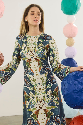 Hunter Bell Townes Dress in Birds of a Feather Navy featuring a colorful allover print, long sleeves, and flowing maxi silhouette.