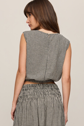Model wearing the Z Supply Merit Gingham Top in Black with a sleeveless silhouette and elasticized hem.
