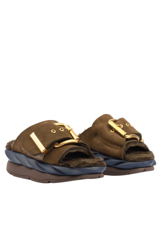 4CCCCEES Mellow Laze Sandal in Chocolate with sheep shearling lining, oversized metal buckle, and navy ripple-designed sole.
