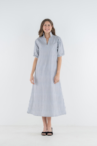 Model wearing the Emily McCarthy Poppy Maxi in Black Stripe with a relaxed maxi-length silhouette.