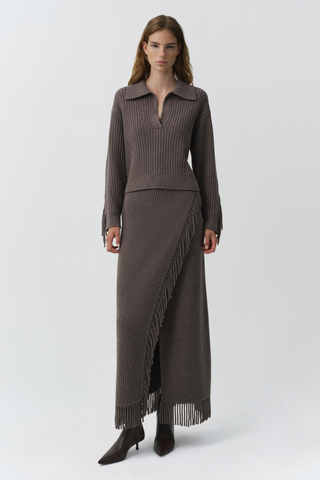SIMKHAI Casey Midi Skirt in mushroom brown knit with a faux-wrap silhouette and fringe trim along the edge and hem.