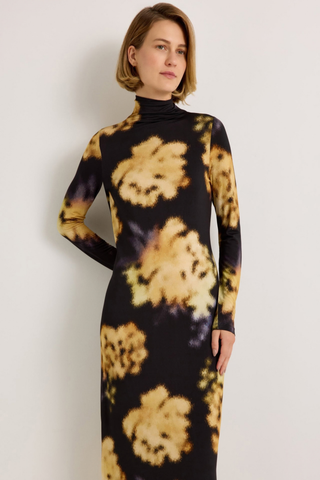 Marie Oliver Paxton Dress in Lush featuring oversized golden floral print on a black stretch jersey midi silhouette.