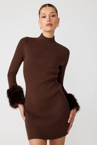 Steve Madden Riello Dress in Dark Espresso brown featuring a fitted ribbed mini silhouette, mock neckline, long sleeves, and faux-fur cuffs.