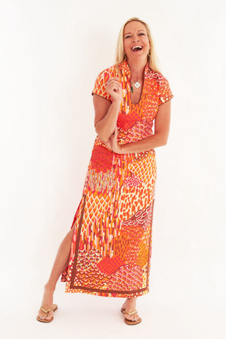 C.K. Bradley Tarpon Dress in Popplet Autumn orange and pink print with short sleeves and a flowing maxi silhouette.
