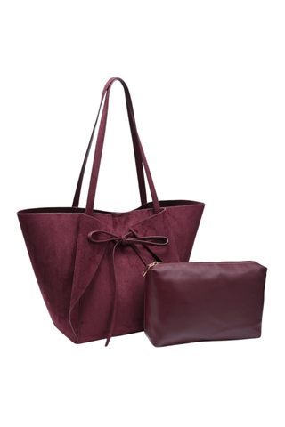 Urban Expressions Soren Tote in Burgundy vegan suede with long shoulder straps, bow-front detail, and matching zip pouch.