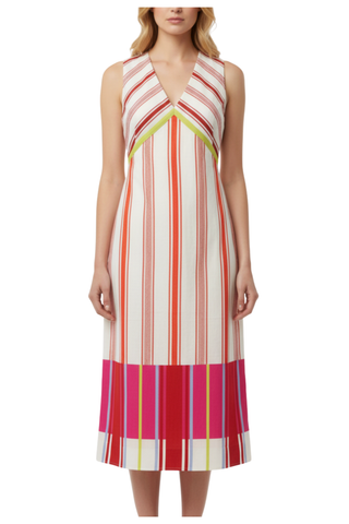 Woman wearing a colorful striped dress on a white background