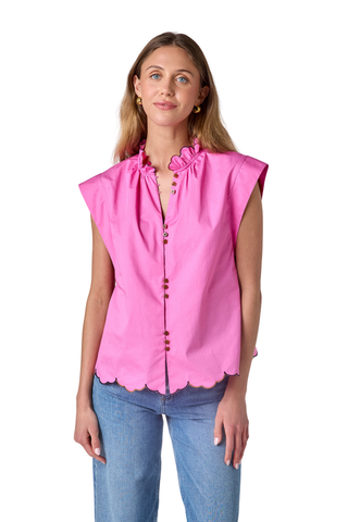 Model wearing the Crosby Fritzy Top in Poppy Pink with cap sleeves and a relaxed silhouette.