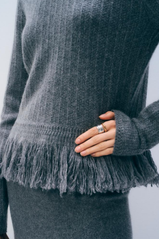 White + Warren Cashmere Blend Fringe Top in Dark Steel Heather featuring a crew neckline, long sleeves, relaxed silhouette, and textured fringe detailing along the hem.