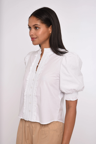 Love the Label Zinny Top in Bright White featuring puff sleeves, delicate trim detailing, smocked cuffs, and a feminine button-front blouse silhouette