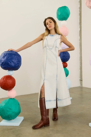 Sleeveless washed blue denim maxi dress with full skirt.