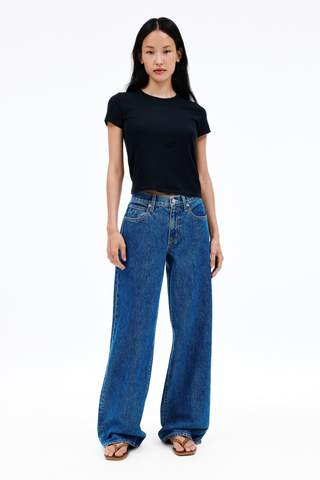 SLVRLAKE Mica Jeans in Sweet Memory featuring a relaxed low-rise fit, wide-leg silhouette, and timeless mid-indigo wash.