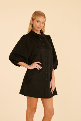 Dolce Cabo A-Line Suede Dress in Black featuring soft faux suede, a collared button front, three-quarter puff sleeves, and an A-line mini silhouette.