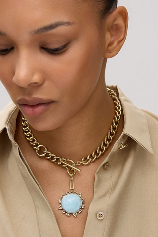 Mignonne Gavigan Odyssey Necklace in Baby Blue featuring a gold chain and removable blue compass charm.