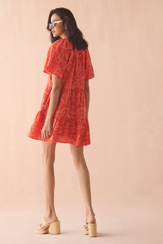 Omika Hadley mini dress in orange Uma Persimmon print with tiered skirt and tie neckline