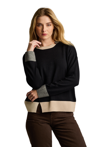 Lisa Todd Bold Block Sweater in Black featuring a crew neckline, long sleeves, and neutral contrast colorblock details at the cuffs and hem.