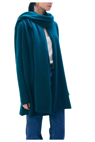 White + Warren Cashmere Travel Wrap in Bright Viridian, a vibrant blue-green oversized cashmere wrap styled around the shoulders.