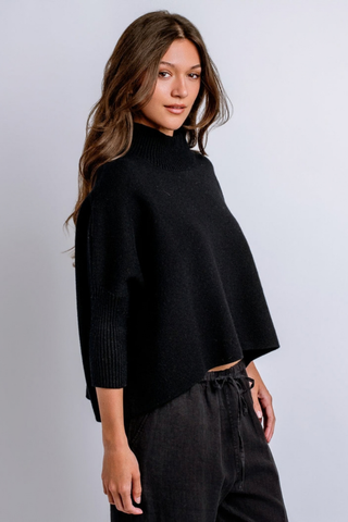 Kerisma Aja Sweater in Black featuring a cropped mock neckline, soft angora-blend knit, and relaxed modern silhouette.