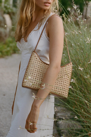 Handwoven rattan shoulder bag with leather trim and strap by Bembien