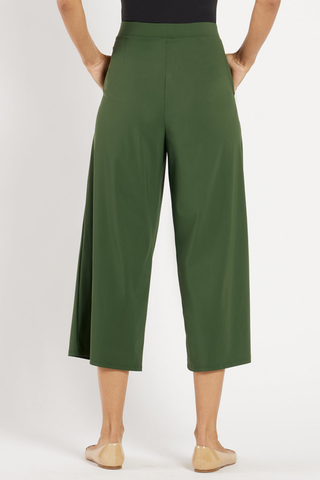Model wearing the Jude Connally Lolly Pants in Loden with a cropped wide-leg silhouette.
