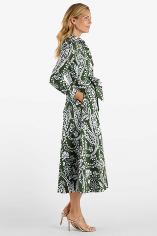 Jude Connally Kitty Dress in Wild Paisley Navy Loden featuring a green and cream paisley print, long sleeves, point collar, and belted midi silhouette.