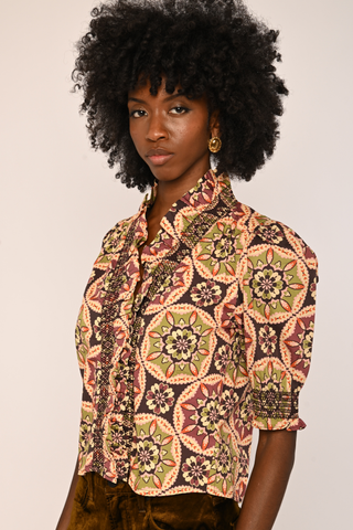 Love the Label Zuri Top in Letters to Hattie Medallion featuring a colorful medallion print, button front, collar, and short puff sleeves.