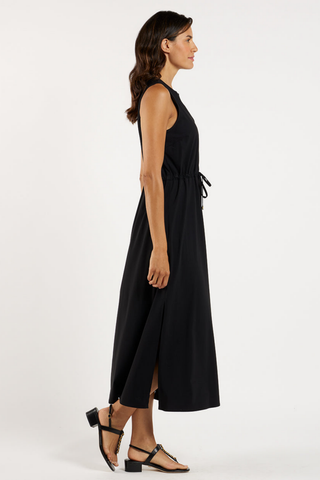 Jude Connally Bebe Dress in Black featuring a sleeveless silhouette, V-neckline, adjustable drawcord waist, and flowing midi-to-maxi length.