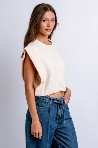 Model wearing the Kerisma Imogen Top in French Vanilla featuring textured knit fabric and extended shoulders.