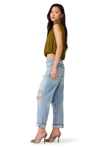 Steve Madden Milana Top in Fir Green, a sleeveless olive green blouse with gathered detailing and a relaxed silhouette.