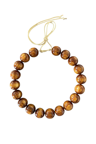 KMS Gems Chunky Beaded Necklace in Maple featuring oversized marbled caramel and golden brown beads with an adjustable silk cord.