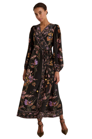 Marie Oliver Everette Dress in Nightshade featuring a dark floral placement print, wrap silhouette, long puff sleeves, and maxi length.
