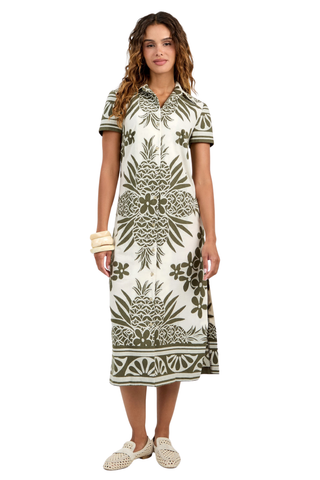 Woman wearing a patterned dress on a white background