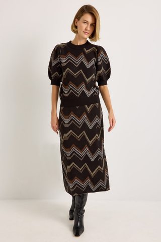 Marie Oliver Maddie Top in Electric featuring a multicolored neutral zigzag knit pattern, short puff sleeves, and ribbed crew neckline.