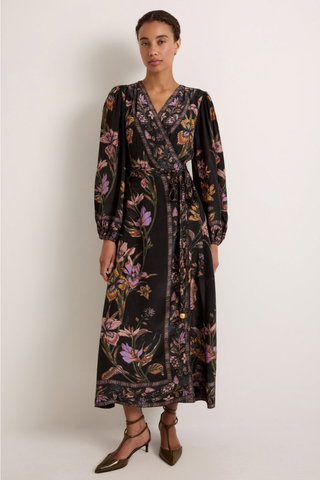 Marie Oliver Everette Dress in Nightshade featuring a dark floral placement print, wrap silhouette, long puff sleeves, and maxi length.