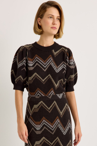 Marie Oliver Maddie Top in Electric featuring a multicolored neutral zigzag knit pattern, short puff sleeves, and ribbed crew neckline.