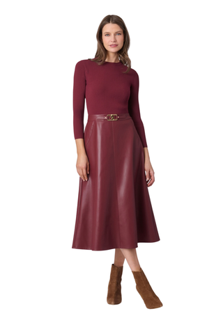 Shoshanna Paige Dress in Burgundy featuring a ribbed knit bodice, three-quarter sleeves, faux leather midi skirt, and buckle waist detail.