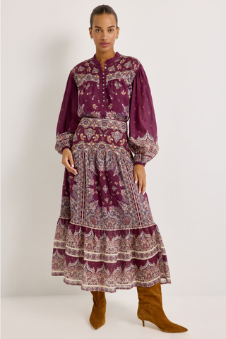 Rhiannon Top in Majesty featuring a rich purple paisley print, stand collar, button front, and full gathered long sleeves.
