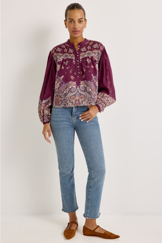 Rhiannon Top in Majesty featuring a rich purple paisley print, stand collar, button front, and full gathered long sleeves.