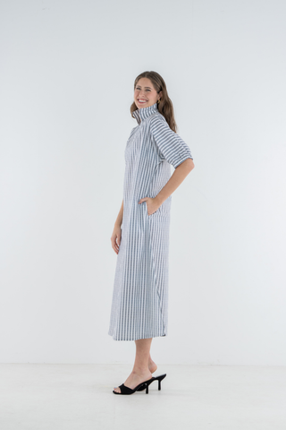 Model wearing the Emily McCarthy Poppy Maxi in Black Stripe with a relaxed maxi-length silhouette.