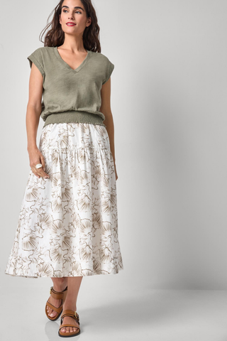 Model wearing the Lilla P Smocked Hem V-Neck Tee in Fern featuring a relaxed blouson fit, V-neckline, extended shoulders, and smocked elastic hem.